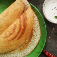 Kal Dosa · Thin, crispy pancake made with idly rice and lentil batter, served with three chutneys and s...