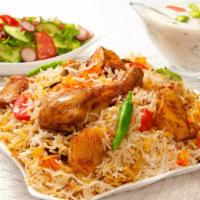 Chicken Biryani · An aromatic rice dish made with seasoned chicken, jeeraga samba rice, and aromatic spices.