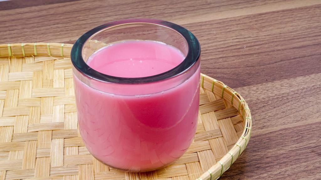 Rose Milk · A cold, aromatic beverage made from chilled milk and rose syrup.