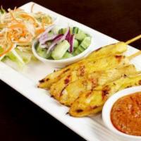 Chicken Satay · Grilled chicken skewers. Served with cucumber salad and peanut sauce.