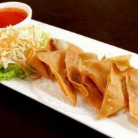 Keaw Tod · Fried, marinated shrimp and pork-stuffed wonton. Served with house sweet and sour sauce.