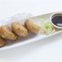 Gui Chai · Crispy chive cakes served with our chef's secret soy sauce.