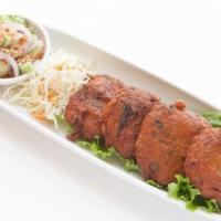 Tod Mum Pla (Fish Cake) · Deep-fried white fish with green beans, kaffir lime leaf, and curry paste, served with cucum...