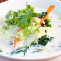 Tom Kha Soup · Spicy coconut milk soup with lemongrass, galanga, kaffir lime leaves, red and green onions, ...