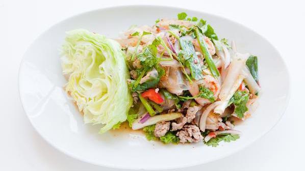Larb Salad · Prepared with lime dressing, chili flakes, onions, parched rice powder, and mint leaves. Choice of minced chicken, pork or beef.