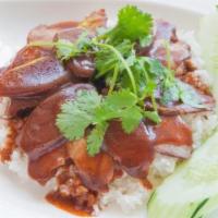 Moo Dang Rice Plate · Homemade roasted pork and Chinese sausage over rice layered with chef's secret gravy sauce.