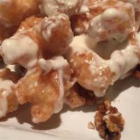 Sesame Walnut Prawns · Tiger prawns and honey-roasted walnuts topped with a creamy sesame sauce.
