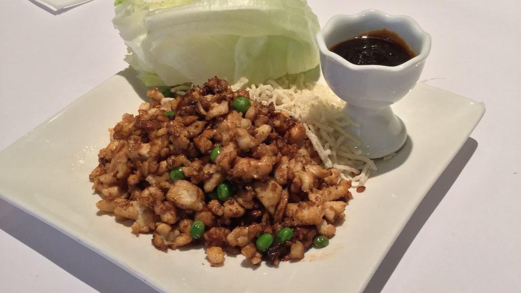 Lettuce Wrapped Chicken · Stir-fried minced chicken, water chestnuts & plum sauce served with iceberg lettuce cups.