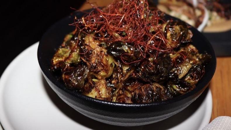 Crispy Brussels Sprouts · spiced maple syrup / aleppo pepper