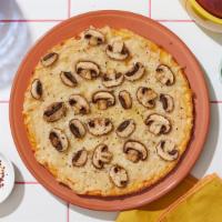 Vegan Recharge Mushroom Pizza · Vegan white pie with mushrooms and vegan cheese.