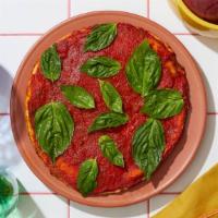 Vegan Blissful Tomato Pizza · Vegan pie with tomato sauce and fresh basil.
