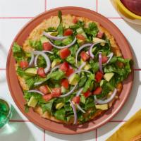 Vegan Bountiful Salad Pizza · Vegan white pie with chopped romaine, red onion, diced tomato, avocado, and balsamic dressing.