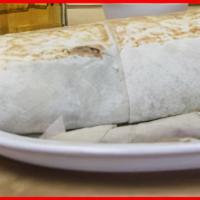 El Comelón / Hungryman · Giant burrito filled with steak, chicken, pork, chorizo, rice, beans, guacamole, sour cream,...