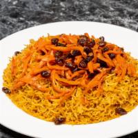Qabili Palau · Rice stuffed with lamb shank topped with carrots and raisins.