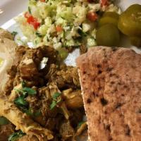 CHICKEN SHAWARMA PLATE · Combo plate with Chicken Shawarma, Hummus, Israeli salad, Pickles, and Tahini sauce. Israeli...