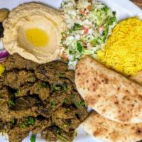 BEEF SHAWARMA PLATE · Boneless Beef meat cooked with spices. Served with Hummus, Israeli salad, Pickles, Tahini sa...
