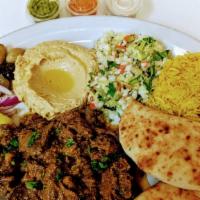 LAMB SHAWARMA PLATE · Lamb marinated in spices and served with Greek Salad and white Basmati rice. Greek salad has...
