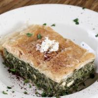 Spinach Pie · A spinach, cheese and olive oil pastry topped with layers of phyllo dough.