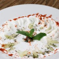 Labni · Syrian yogurt topped with dry mint and olive oil, served with pita.