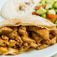 Chicken Shawarma Wrap · Marinated chicken pieces wrapped with lettuce, tomato, pickles and tahini sauce in pita bread.