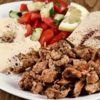 Chicken Shawarma Platter · Marinated pieces of grilled-cooked chicken served with hummus, cucumber salad, pita, garlic ...