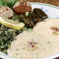 Mezze Platter · Hummus, taboulah, baba ganouj, dolma and falafel. Served with pita.