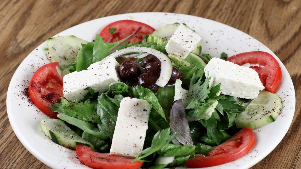 Greek Salad · Diced cucumber, tomato and onion mixed with Italian dressing and topped with feta cheese and Kalamata olives.