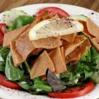 Fattoush Salad · Diced cucumber, lettuce and tomato pieces mixed with mint and vinegar, topped with oven-toas...