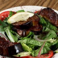 Eggplant Salad · Romaine lettuce mixed with vinaigrette dressing and topped with artichoke hearts, eggplant p...