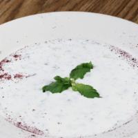 Yogurt Salad · Homemade yogurt mixed with diced cucumber, dry mint and salt.