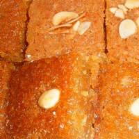 Namoura (1 Slice) · Almond cake with syrup and topped with sliced almonds. Made in house.