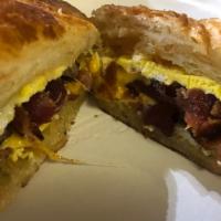 Breakfast Sandwich on a Croissant  · Scrambled Egg, Meat, and Cheese served on a grilled Croissant
