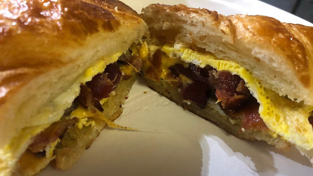 Breakfast Sandwich on a Croissant  · Scrambled Egg, Meat, and Cheese served on a grilled Croissant