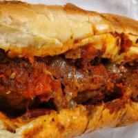 Marybeth's Meatball · Homemade Meatballs in a slightly spicy tomato sauce served hot on your choice of roll with P...