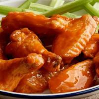 Tangy Gold Wings · Crispy, saucy, and tangy gold wings.