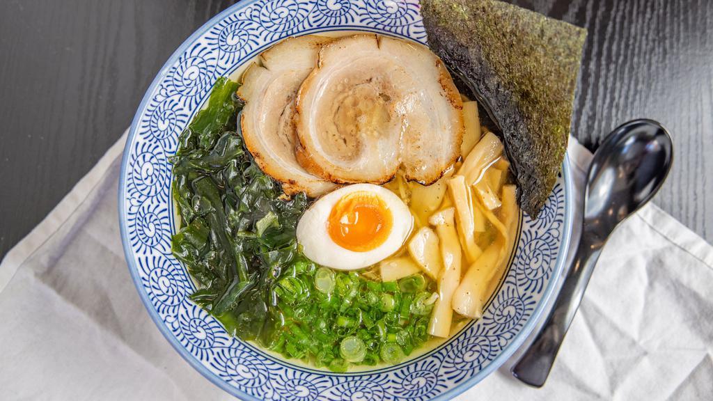Traditional Shio Ramen · Chicken broth with salt base topped with pork chashu, green onions, bamboo shoots, wakame seaweed, nori seaweed and egg.