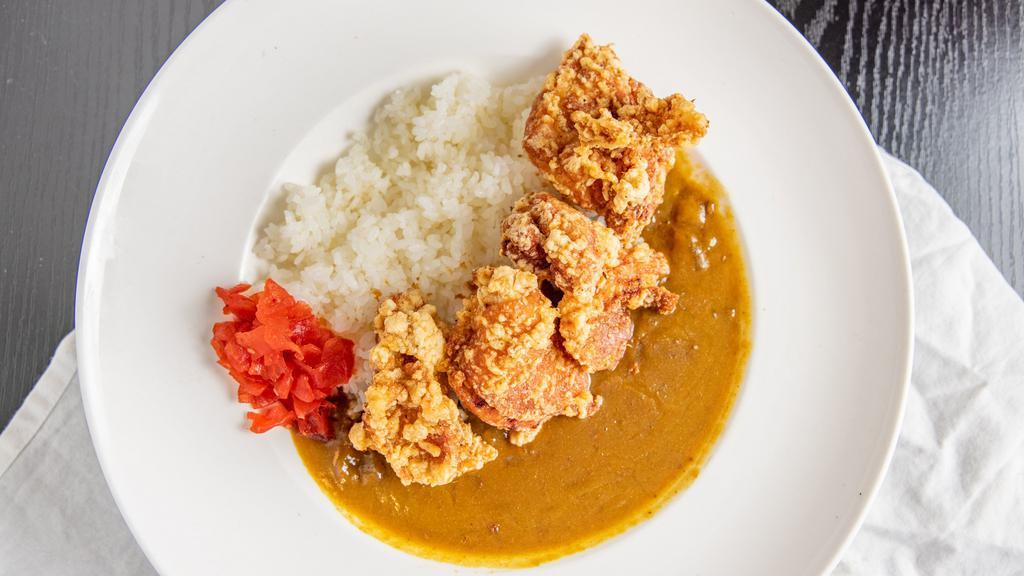 Karaage Curry · Beef based curry with Japanese fried chicken, rice, and a small salad