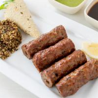 Lamb Seekh Kebab · Gluten-free. Superior farms lamb, ginger, mint, and home-made spices. Served with organic bu...