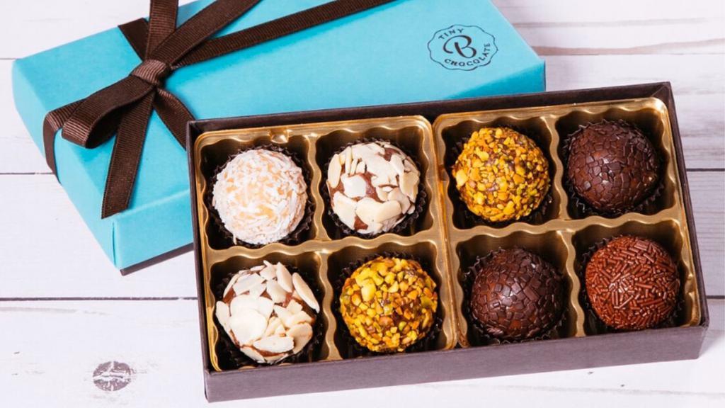 Gift Box (8 brigadeiros) · Classic flavors in each box
dark chocolate & sprinkles
dark chocolate & almonds
dark chocolate & pistachio
coconut & cream
milk chocolate & sprinkles