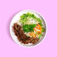 Grilled Steak Vermicelli Noodle Bowl · Marinated beef with lettuce, cucumber topped with crushed peanut, green onion oil, pickled c...