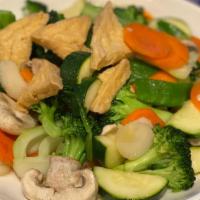 Vegetable Deluxe · An assortment of vegetables, including white mushrooms, snow peas, tofu, carrots, water ches...