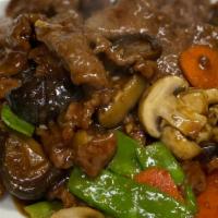 Double Mushroom Beef or Lamb · Sliced & sautéed with black & white mushrooms, carrots and snow peas in brown sauce.