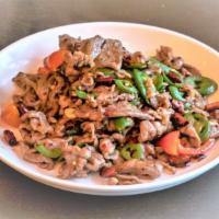 Xingjiang Lamb · Spicy. House special. stir fried with green hot peppers, cumin and chili powders.