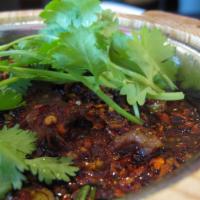 Spicy Boiled Beef or Lamb · Spicy. House special. poached with napa cabbages, garlic roots & prickly ash, in hot chili o...