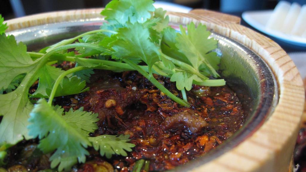 Spicy Boiled Beef or Lamb · Spicy. House special. poached with napa cabbages, garlic roots & prickly ash, in hot chili oil & topped with cilantros.