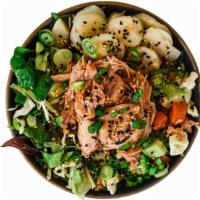 Chicken Greens Bowl · base of mixed greens & shredded cabbage, umami signature juicy pulled chicken, crisp water c...