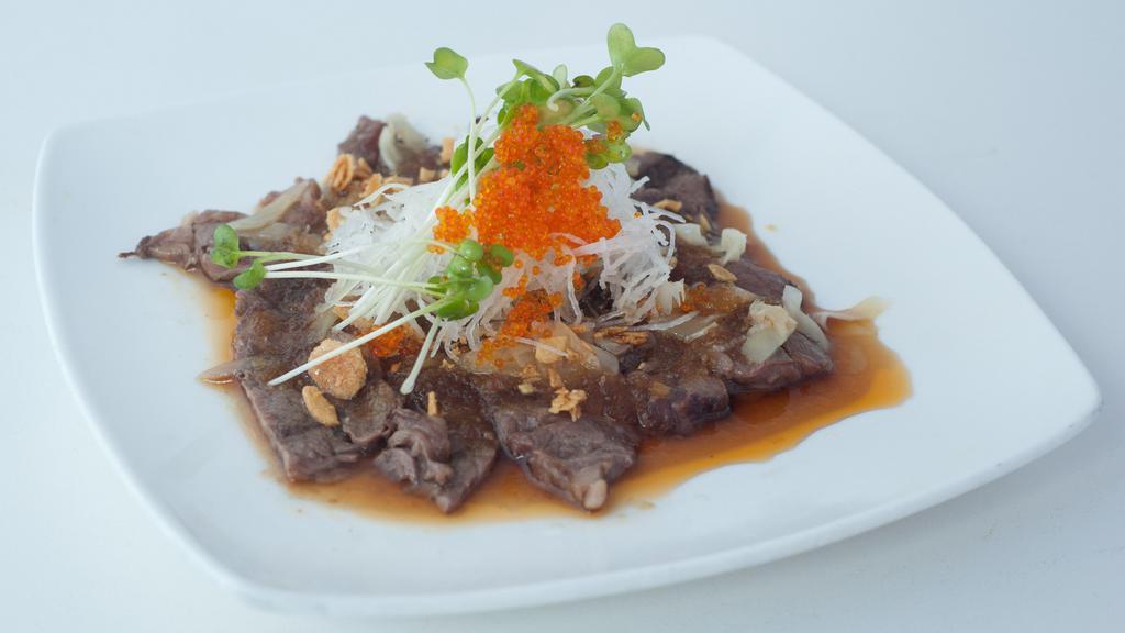 Beef Tataki · Sliced seared beef, tobiko with ginger sauce.