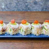 Ginza Roll · Shrimp tempura, avocado and cucumber topped with torched hamachi, jalapeño and spicy tuna.