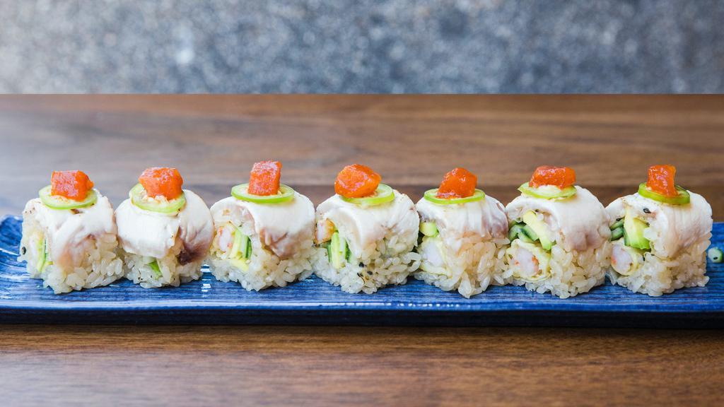 Ginza Roll · Shrimp tempura, avocado and cucumber topped with torched hamachi, jalapeño and spicy tuna.
