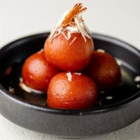 Gulab Jamun · Deep fried balls made of milk powder, flour, butter and milk and then soaked in sugar syrup.